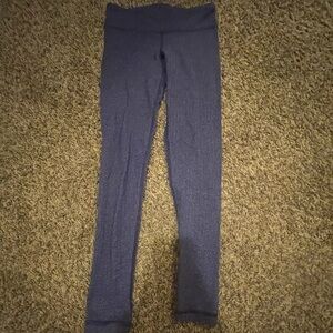 Ivivva leggings that are discontinued and purple with white zigzags.